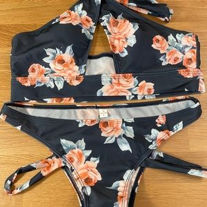NWOT size L floral bikini. Navy blue with flowers. Super cute floral bikini.